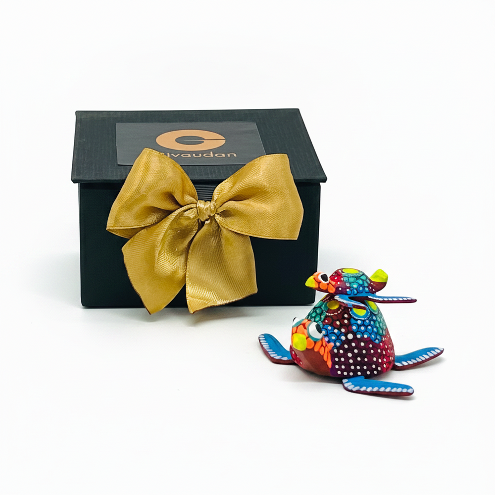 Alebrije chico de madera en estuche ejecutivo rígido diseñado para regalos empresariales premium por Ambiente Mexicano